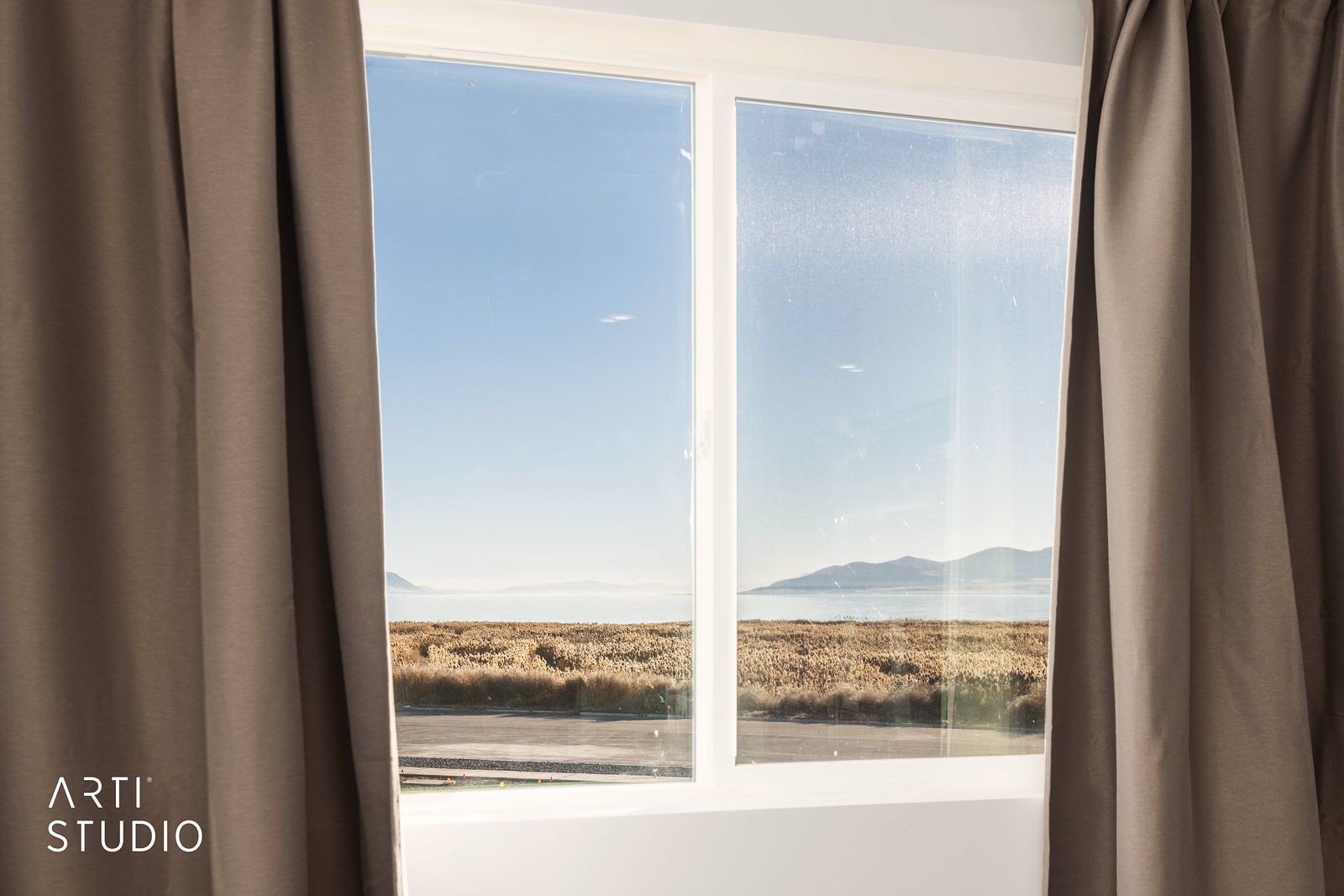 Window framing Utah Lake and the mountains beyond